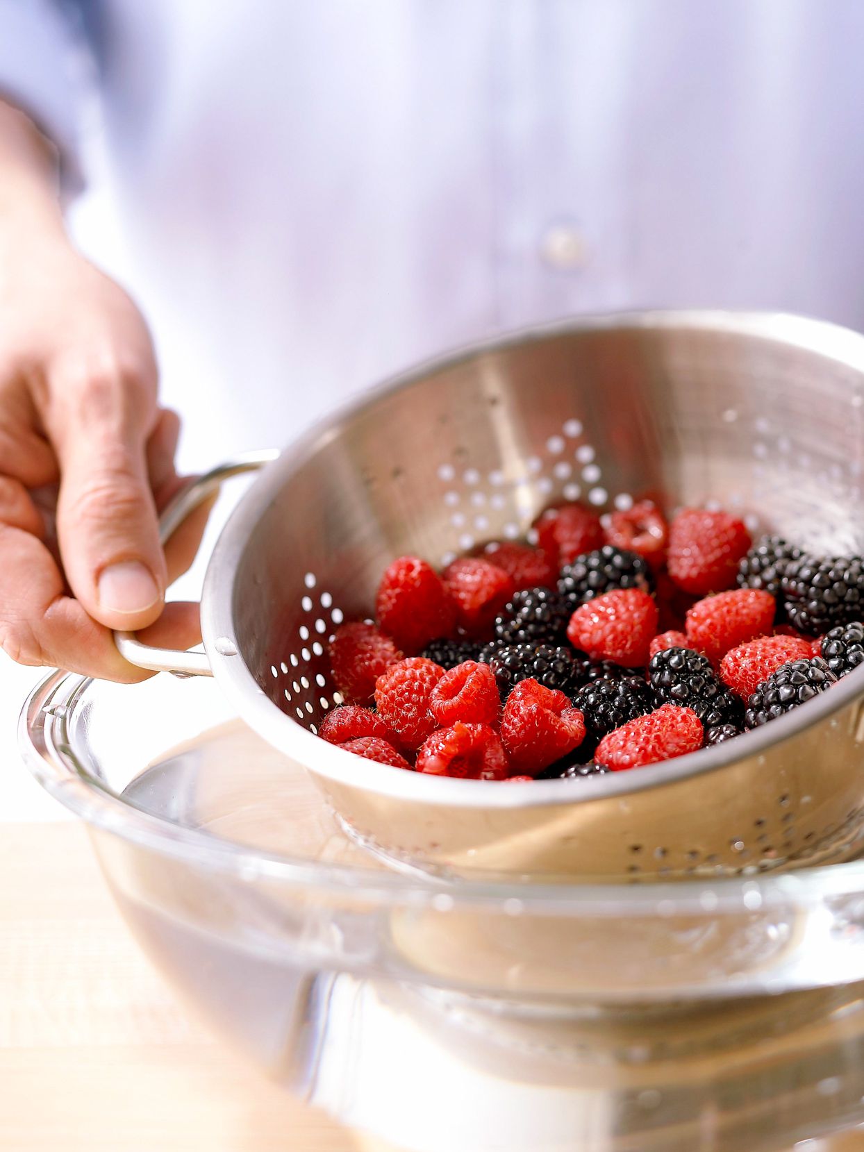 Unwashed berries in a colander